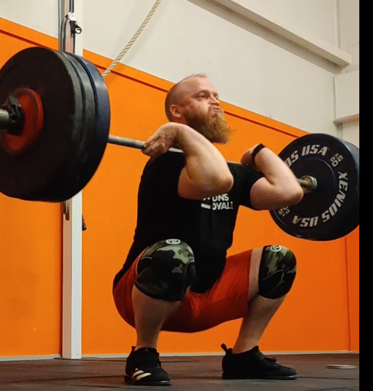 A person performing a clean and jerk lift